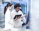 Two Scientist Looking at the Computer Monitor