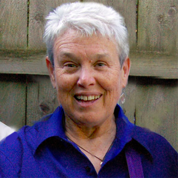Jeanne Mackey wears a blue shirt.