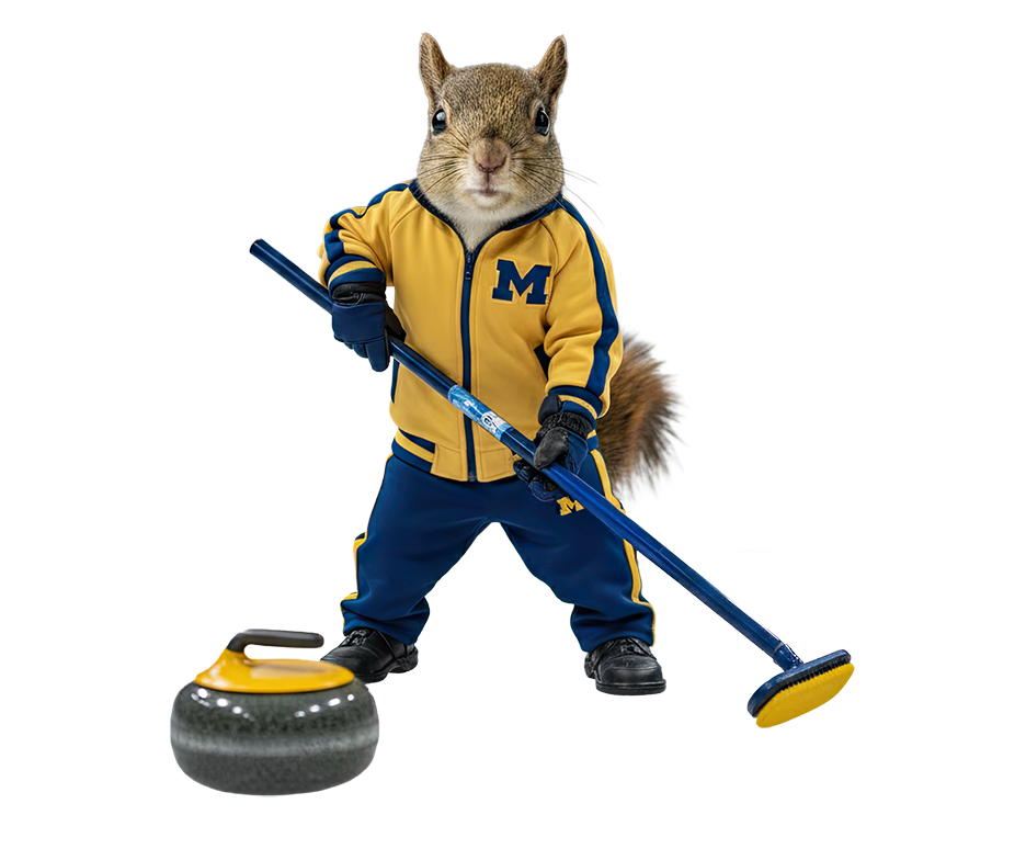 A squirrel wearing a University of Michigan track suit holding a broom next to a curling stone.